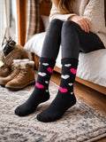 Women wearing black knee-high socks with heart patterns sitting on a bed.

Active Star Ladies Thermal Fashion Socks Pack of 3