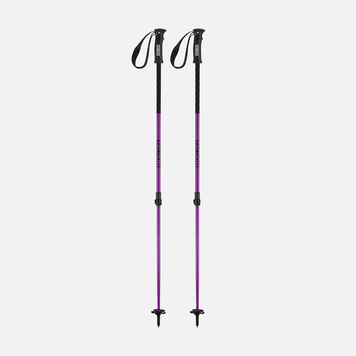 Two purple and black ski poles on a light gray background