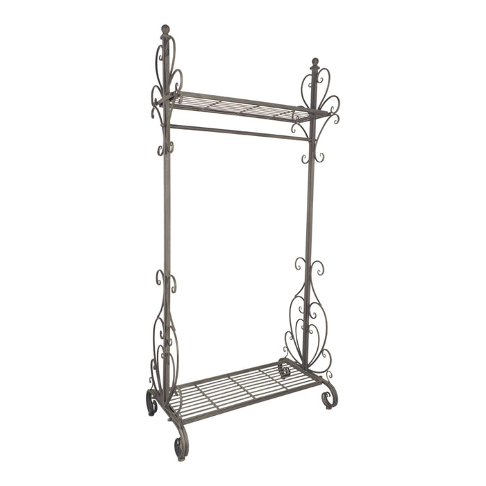The Arlette Coat Rack Rail is an elegant unit with two open iron shelves and ornate scrollwork on the sides, finished in antique silver.