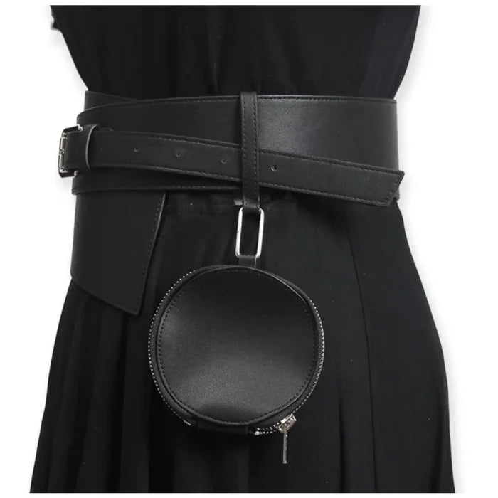 Asymmetric wide waist belt with detachable round mini bag styled over black dress