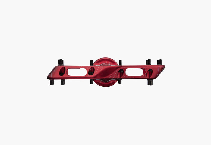 Red metal component on a white background