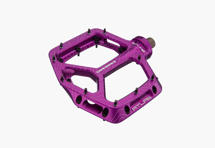 Purple bicycle pedal on a white background