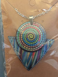 aztec necklace featuring tribal-inspired design, worn as a statement accessory for everyday or evening wear