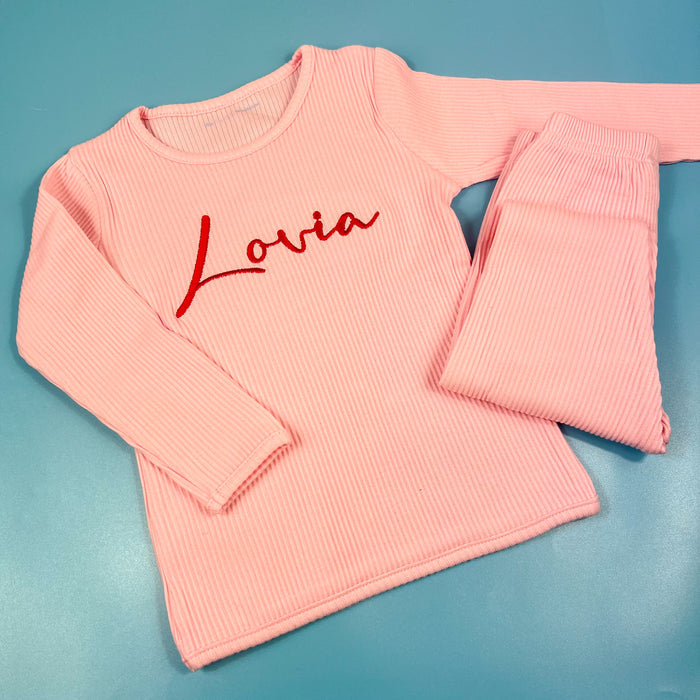 Pink ribbed tracksuit with Lovia embroidered on the front in red
