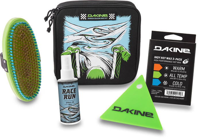Dakine ski maintenance kit with brush, spray bottle, and other tools on a white background