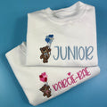 Jumpers with a teddy bear holding love heart balloons embroidered on the front with child’s name