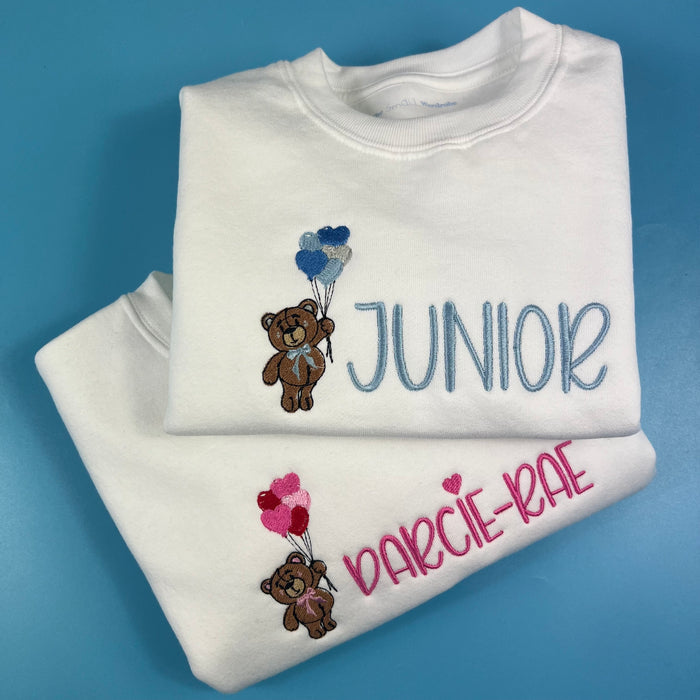 2 White sweatshirt with a bear holding heart balloons with child’s name embroidered on the front
