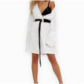Waist-enhancing black fashion belt with asymmetrical shape and adjustable fit