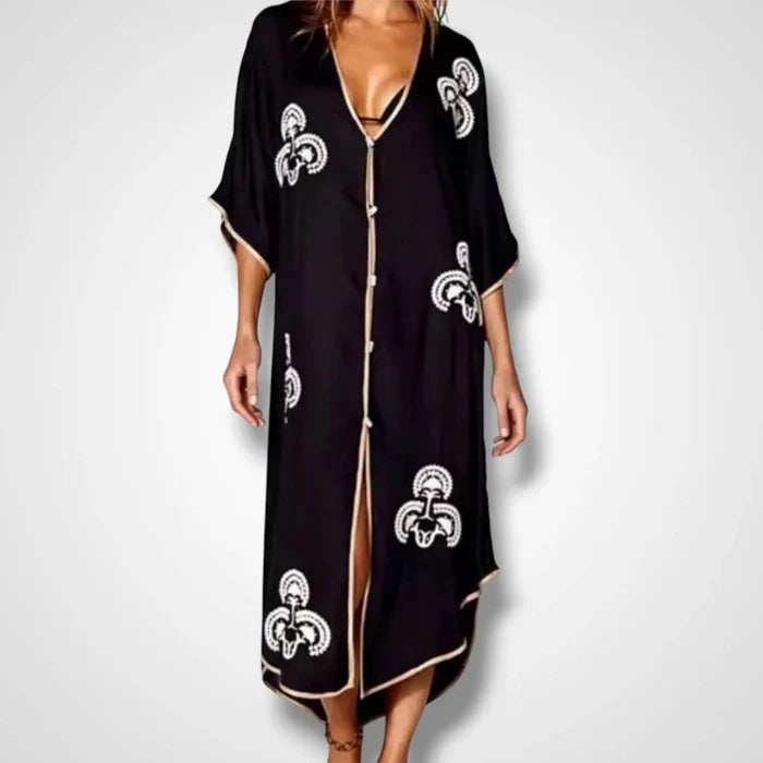 Black Button Down Embroidered Moroccan Kaftan with white embroidery, gold trim, and abalone shell buttons