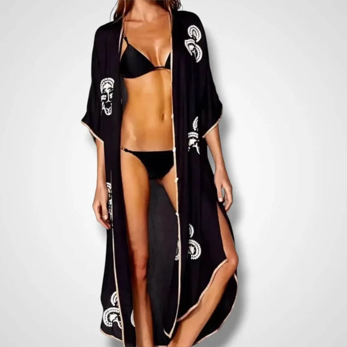Black Button Down Embroidered Moroccan Kaftan with white embroidery, gold trim, and abalone shell buttons