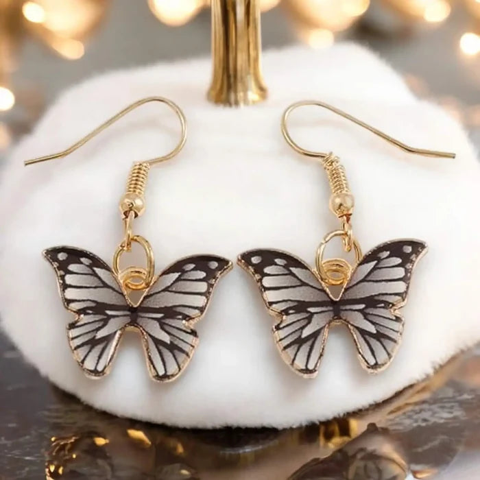 Black Charming Butterfly Dangling Earrings with gold-tone hooks and enamel wings/ women's / one size