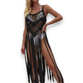 Black Fringe Knit Long Cover Up hollow-out crochet pattern, sleeveless cut, and tassel hem. Ideal for boho, resort, or festival wear over swimwear or attire!