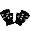 close-up skull and crossbones design on black knit fingerless gloves