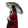 Model holding a Black Lace Vintage Parasol Umbrella with an intricate floral pattern and curved J-handle, Victorian Gothic style.