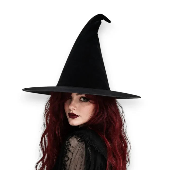 woman wearing the Black Magic Velvet Witch Hat with 14 inch tall pointed crown, 3.5 inch flat brim, and soft black velvet texture osfm