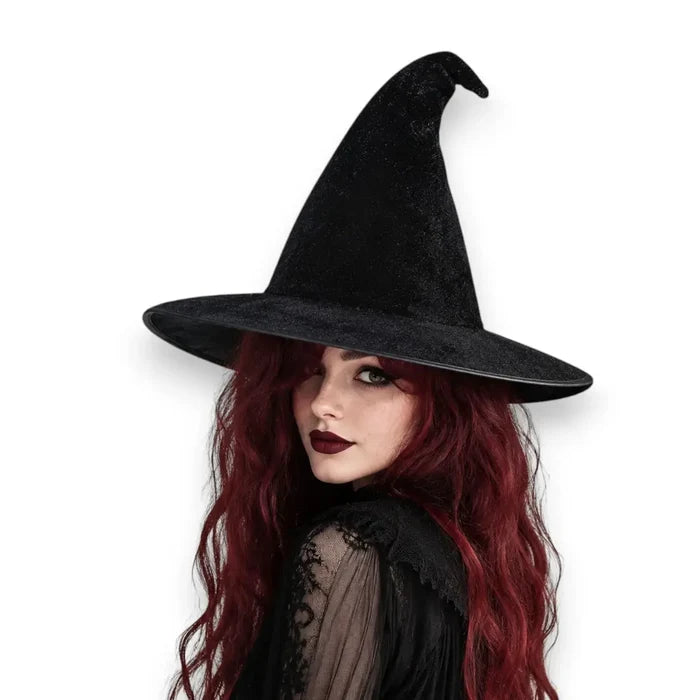 woman wearing Black Magic Velvet Witch Hat with 14 inch tall pointed crown, 3.5 inch flat brim, and soft black velvet texture osfm