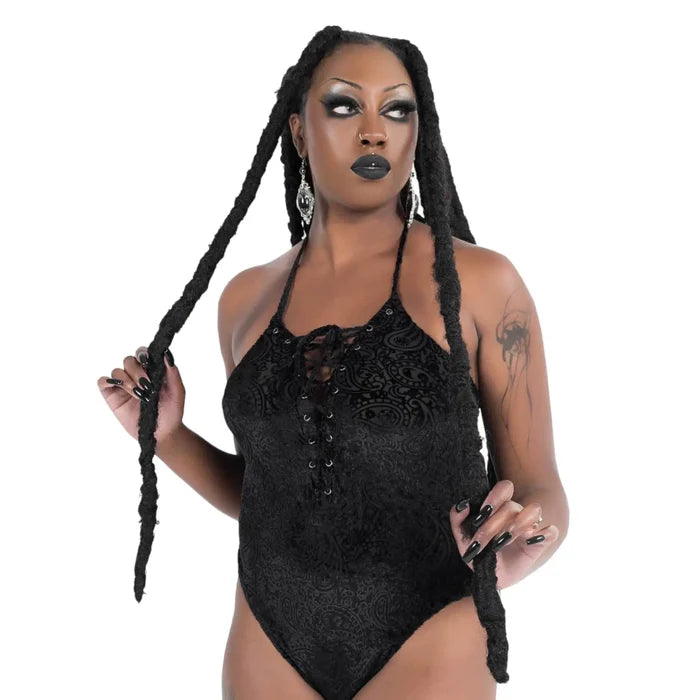 woman wearings Black Midnyte Velvet Bodysuit by Killstar lace-up halter backless gothic top/ women's/ lg/ xl