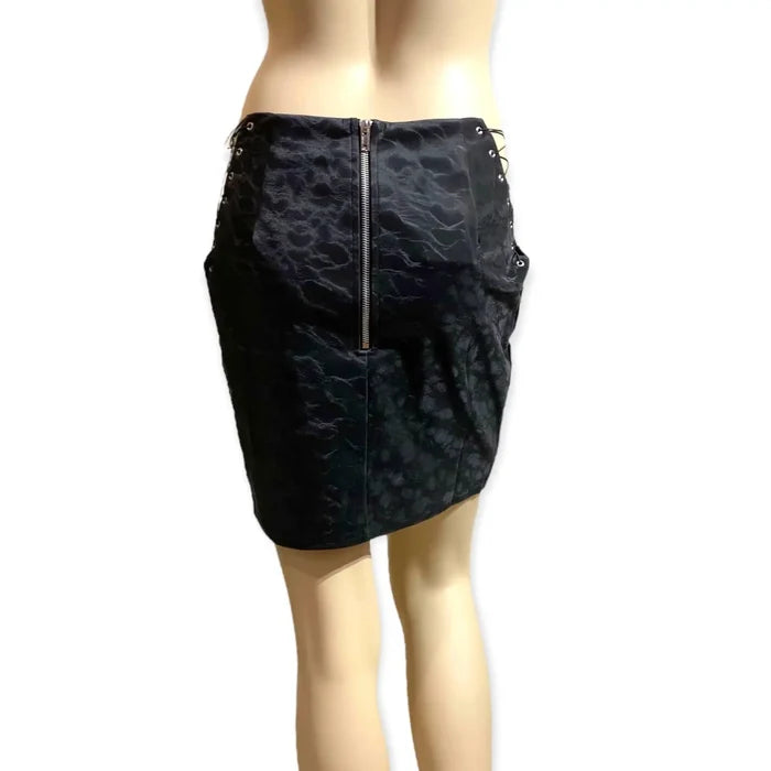 exposed back zipper detail of black mini skirt on model