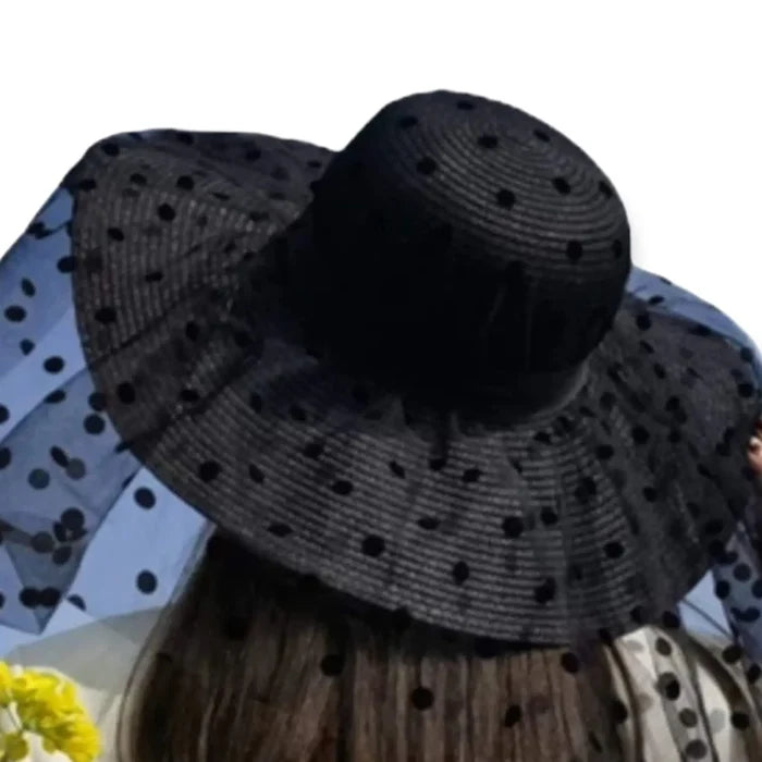 Black wide brim straw sun hat with sheer polka dot mesh overlay, gothic and punk summer fashion.
