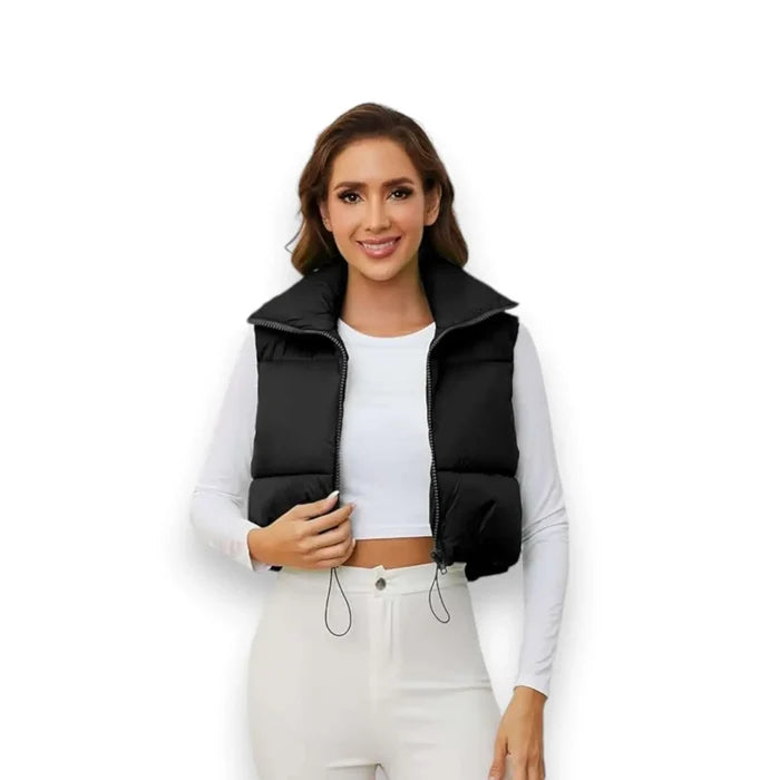 model wearing black cropped puffer vest with tall collar, open front white background