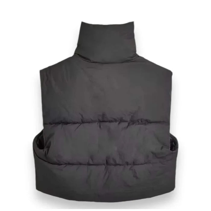 detail of tall stand collar on black puffer vest back view flat lay
