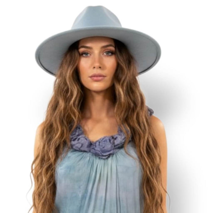 woman wearing with blue fedora Blue Sleeveless Tiered A-Line Maxi Dress with floral rosettes, crochet lace hem, and boho style / women's / large