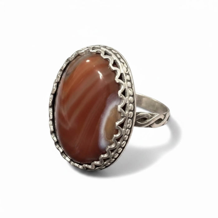 Boho Western Burnt Orange Carnelian Silver Ring with oval lace agate and braided silver band 6.75 side view white background