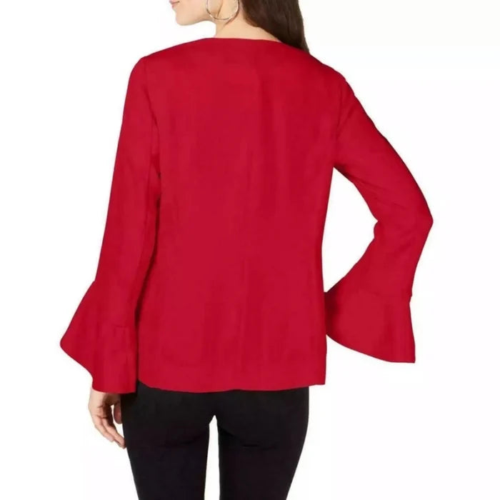 woman wearing back view Bold Red Bell Sleeve Blazer with tulip cuffs, collarless open front, thigh-length cut, and functional pockets