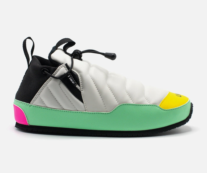 Multicolored sneaker with black, white, green, pink, and yellow accents on a light gray background