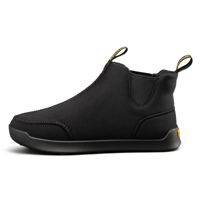 Black slip-on shoe with yellow accents on a white background