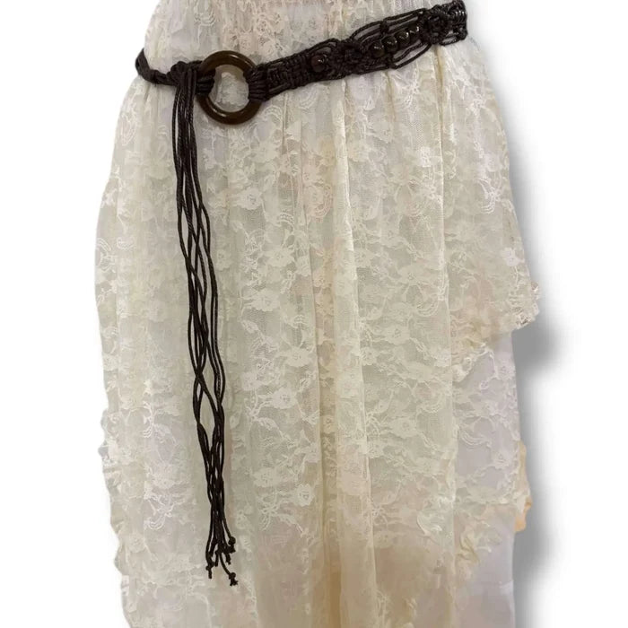 brown braided beaded tassel belt with wood ring buckle fringe styled at the waist over a boho skirt