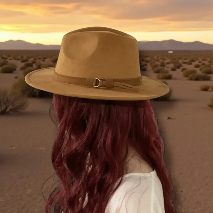 woman  wearing a brown  suede fedora hat in the desert