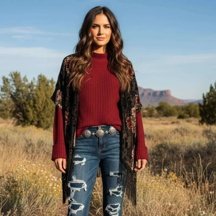 woman wearing a burgundy mock neck rib knitted sweater with wide cuff sleeves