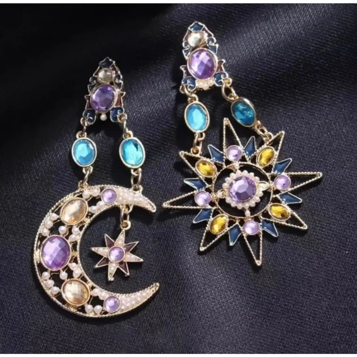 Celestial Gold Stars Moons Hanging Earrings with multicolored crystals, faux pearls, asymmetrical drop statement earrings on black background