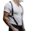 man wearing a pair of black chest harness with silver trigger clips