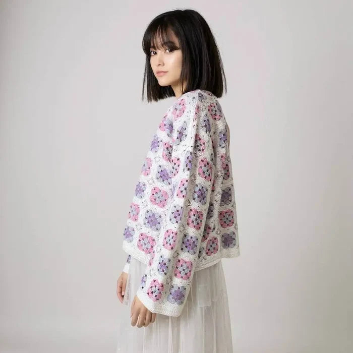 women wearing wide sleeve crochet cardigan pastel pink purple blue side view