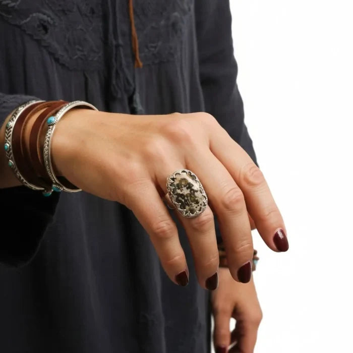Custom Ocean Jasper ring with natural orbicular stone, sterling silver fleur-de-lis bezel and hammered band