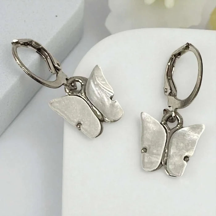 Dainty Charm Butterfly Earrings with iridescent shell-look wings and coquette style white silver