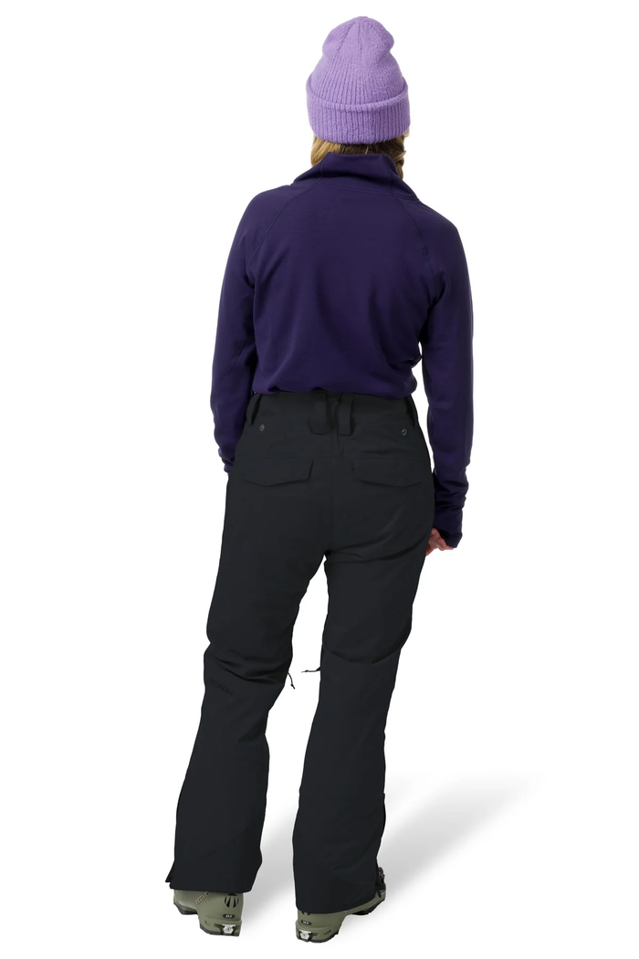 Person wearing a purple jacket and black pants with a white background