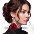 woman wearing Dark Red Velvet Rose Pearl Statement Earrings with silver chain threaders and gothic style