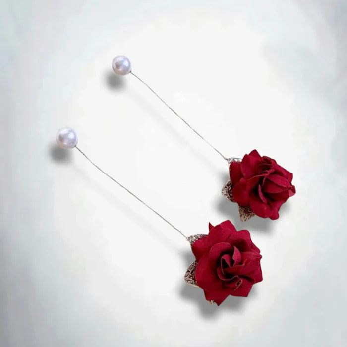 flat lay Dark Red Velvet Rose Pearl Statement Earrings with silver chain threaders and gothic style