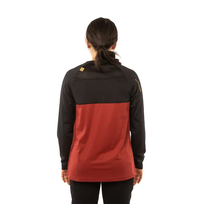Person wearing a black and red jacket on a white background