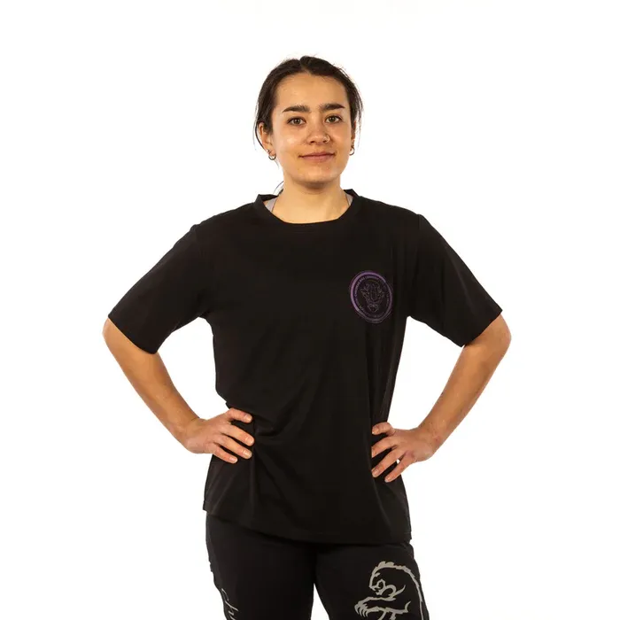 Person wearing a black t-shirt with a logo on a white background