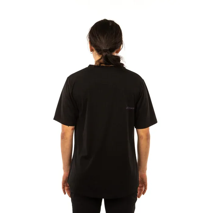 Person wearing a black t-shirt with a logo on the back against a white background