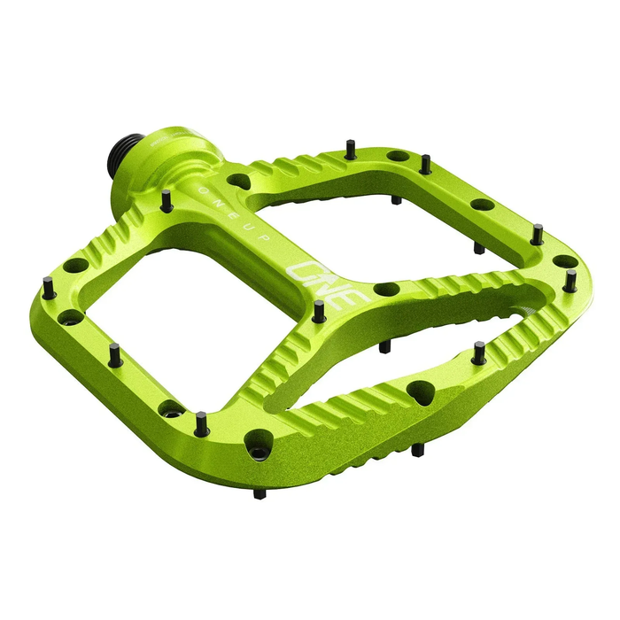 Green bicycle pedal on a white background