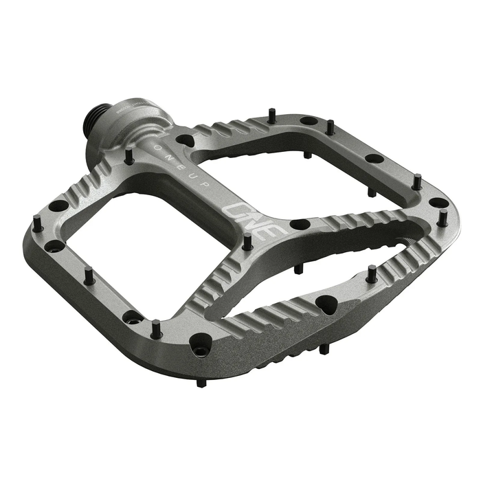 Bicycle pedal with 'OneUp' branding on a white background