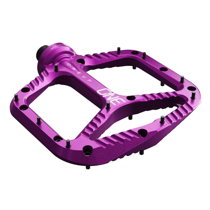 Purple bicycle pedal with 'ONEUP' branding on a white background