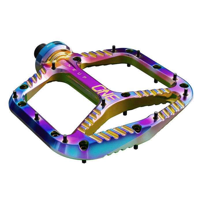 Multicolored bicycle pedal with 'OneUp' branding on a white background