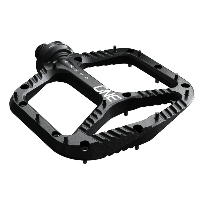 Black bicycle pedal with 'OneUp' branding on a white background