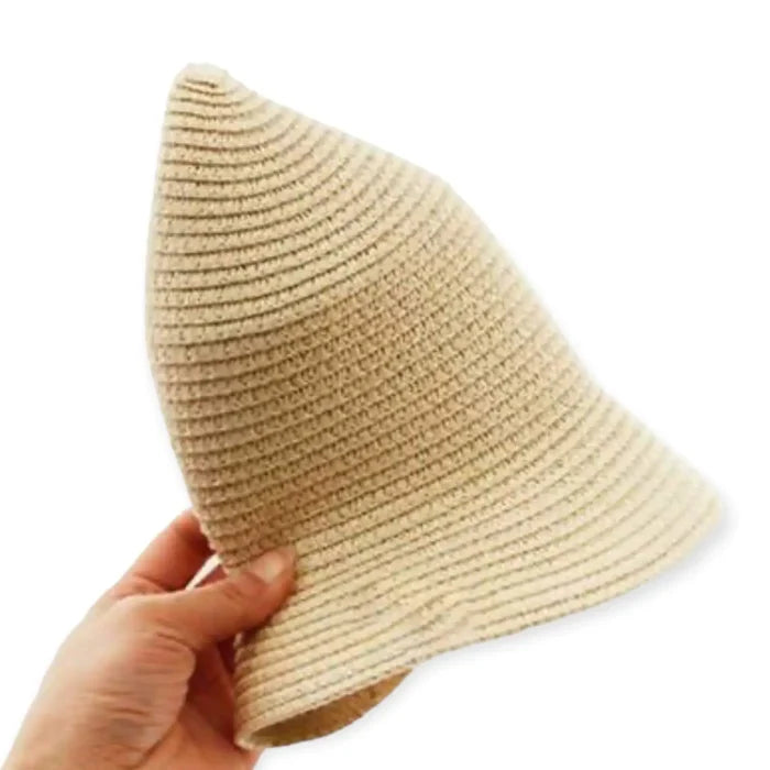 Floral Crown Summer Straw Hat shown in hand, featuring a lightweight textured design ideal for warm weather and festivals.